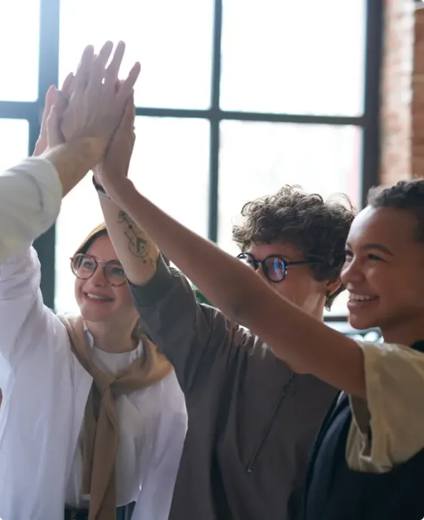 Group of diverse coworkers high fiving