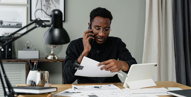 man working on finances in office