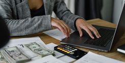 woman budgeting on laptop