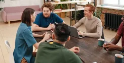 group of employees discussing lifestyle creep