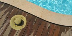 brown sunhat near swimming pool