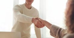 man and woman shaking hands